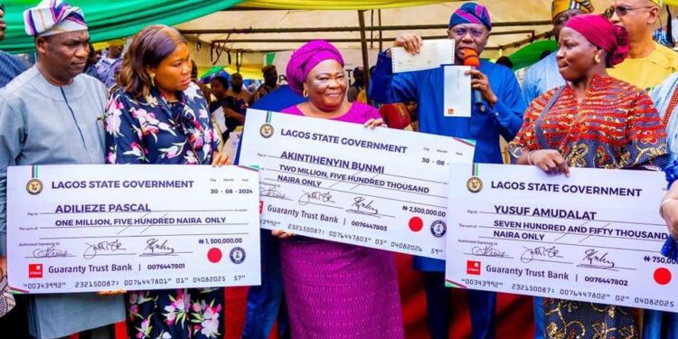 SANWO-OLU PAYS COMPENSATION TO VICTIMS OF DOCEMO FIRE INCIDENT